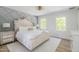 Inviting bedroom with detailed accent wall and two large windows for natural light at 3010 Blueberry Ln, Chapel Hill, NC 27516