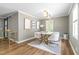 Dining room featuring a modern table with seating for six and natural light at 3010 Blueberry Ln, Chapel Hill, NC 27516