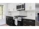 Contemporary kitchen with stainless steel appliances, modern oven, and custom tile backsplash at 3010 Blueberry Ln, Chapel Hill, NC 27516