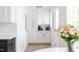 Bright kitchen featuring white cabinetry with gold hardware and modern appliances at 3010 Blueberry Ln, Chapel Hill, NC 27516