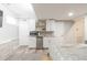 This kitchenette features white cabinets and stainless steel appliances at 3010 Blueberry Ln, Chapel Hill, NC 27516