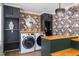 Bright laundry room with charming wallpaper and new washer and dryer at 3010 Blueberry Ln, Chapel Hill, NC 27516