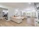 Elegantly furnished living room with stylish decor, modern fireplace, and hardwood flooring at 3010 Blueberry Ln, Chapel Hill, NC 27516