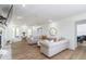 Bright and airy living room with hardwood floors, neutral-toned furniture, and a decorative fireplace at 3010 Blueberry Ln, Chapel Hill, NC 27516