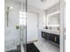 Modern bath includes a spacious glass shower with black tile accents and rain shower head at 3010 Blueberry Ln, Chapel Hill, NC 27516