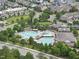 A resort style community pool features sunning chairs, a slide and a lap pool at 3033 Remington Oaks Cir, Cary, NC 27519