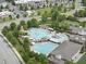 A resort style community pool features sunning chairs, a slide and a lap pool at 3033 Remington Oaks Cir, Cary, NC 27519