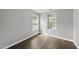 A bright bedroom features wood-look flooring and natural light at 3033 Remington Oaks Cir, Cary, NC 27519