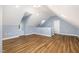 Finished attic with wood flooring and neutral colors at 309 Appaloosa Trl, Bahama, NC 27503