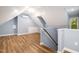 A finished attic is brightened by a neutral color scheme and wood floors at 309 Appaloosa Trl, Bahama, NC 27503
