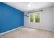 Cozy bedroom featuring carpeted floors and natural light at 309 Appaloosa Trl, Bahama, NC 27503