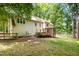 Traditional home with a large backyard featuring a deck and screened porch is perfect for relaxing and entertaining guests at 309 Appaloosa Trl, Bahama, NC 27503