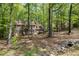 Traditional brick home nestled among trees with attractive landscaping and charming curb appeal at 309 Appaloosa Trl, Bahama, NC 27503