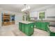 Bright kitchen featuring granite countertops, stainless steel appliances, and green cabinets at 309 Appaloosa Trl, Bahama, NC 27503