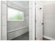 Large shower featuring floor to ceiling tile, gray rock floor and built in bench at 309 Appaloosa Trl, Bahama, NC 27503