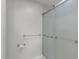 Neutral bathroom with a glass-enclosed shower and towel bars at 318 Duck Pond Ln, Clayton, NC 27520