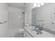 Bathroom featuring a shower, a vanity with sink and faucet, and white painted walls at 318 Duck Pond Ln, Clayton, NC 27520