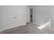 Bedroom showcasing closet with doors, light-gray walls, plush carpeting, and natural light at 318 Duck Pond Ln, Clayton, NC 27520