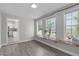 Sunroom with natural light and wood accent bench under large windows at 318 Duck Pond Ln, Clayton, NC 27520