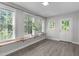 Bright bonus room features large windows and light wood-look flooring at 318 Duck Pond Ln, Clayton, NC 27520