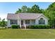 Lovely single-story home offering a well-kept lawn and attractive curb appeal at 318 Duck Pond Ln, Clayton, NC 27520