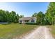 Charming home with gravel drive and tidy landscaping at 318 Duck Pond Ln, Clayton, NC 27520