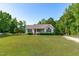 Well maintained ranch home with green shutters and nice landscaping at 318 Duck Pond Ln, Clayton, NC 27520