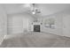 Spacious living room with a fireplace, vaulted ceilings, and neutral carpet at 318 Duck Pond Ln, Clayton, NC 27520