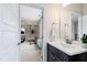 Bathroom vanity with a glimpse into an adjacent room with gym equipment at 3209 Bryant Falls Ct, Raleigh, NC 27613