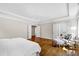 Spacious main bedroom with neutral tones, hardwood floors, recessed lights, tray ceiling, and sitting area near the bath at 3209 Bryant Falls Ct, Raleigh, NC 27613