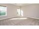 Bright bedroom with neutral carpet, lots of natural light, and fresh paint for a relaxing atmosphere at 33 Juliette Dr, Durham, NC 27713