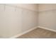 Walk in closet with shelving and storage for ultimate organization with neutral carpet and fresh paint at 33 Juliette Dr, Durham, NC 27713