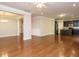 Open-concept living area with hardwood floors, providing seamless flow between living room, dining, and kitchen spaces at 33 Juliette Dr, Durham, NC 27713