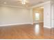 Expansive living room showcasing hardwood floors, crown molding, and recessed lighting for a modern touch at 33 Juliette Dr, Durham, NC 27713