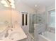 Beautiful bathroom featuring double sinks, a glass shower, and a soaking tub at 3339 Archdale Dr, Raleigh, NC 27614
