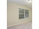 Simple bedroom with a window, neutral carpet, and blank canvas at 3339 Archdale Dr, Raleigh, NC 27614