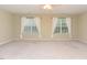 Bright and airy bedroom with large windows and neutral decor at 3339 Archdale Dr, Raleigh, NC 27614