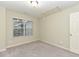 A neutral room with a carpeted floor, a window, and blank canvas at 3339 Archdale Dr, Raleigh, NC 27614