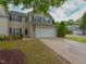 Charming two-story home with a two-car garage, well-manicured lawn, and inviting curb appeal at 3339 Archdale Dr, Raleigh, NC 27614