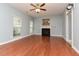 This cozy living room has hardwood floors and a fireplace, offering a comfortable space to relax at 3339 Archdale Dr, Raleigh, NC 27614
