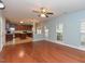 The open-concept living room features hardwood floors and ample natural light, seamlessly connecting to the kitchen at 3339 Archdale Dr, Raleigh, NC 27614