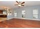 Hardwood floors and large windows highlight the transition of the living room to the kitchen at 3339 Archdale Dr, Raleigh, NC 27614
