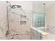 Close up of a luxurious glass shower with custom tile work and built-in niches at 3339 Archdale Dr, Raleigh, NC 27614