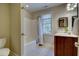 Cozy bathroom with tiled floors, a shower-tub, and a vanity with a dark wood finish at 3357 Denise St, Durham, NC 27704