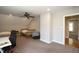 Spacious bedroom with ceiling fan, carpeted floor, and a large closet at 3357 Denise St, Durham, NC 27704