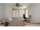 Bright bedroom featuring a ceiling fan, carpeted floors, and ample closet space at 3357 Denise St, Durham, NC 27704