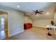 Large bonus room with carpet, a ceiling fan, and space for a home office at 3357 Denise St, Durham, NC 27704