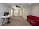Spacious bonus room with carpet, ceiling fan, and natural light at 3357 Denise St, Durham, NC 27704
