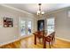 Bright dining room features hardwood floors, modern lighting, and access to an outdoor deck at 3357 Denise St, Durham, NC 27704