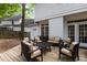 This backyard has outdoor seating with a large wood deck and white exterior elevation at 3401 Scotch Dr, Raleigh, NC 27616